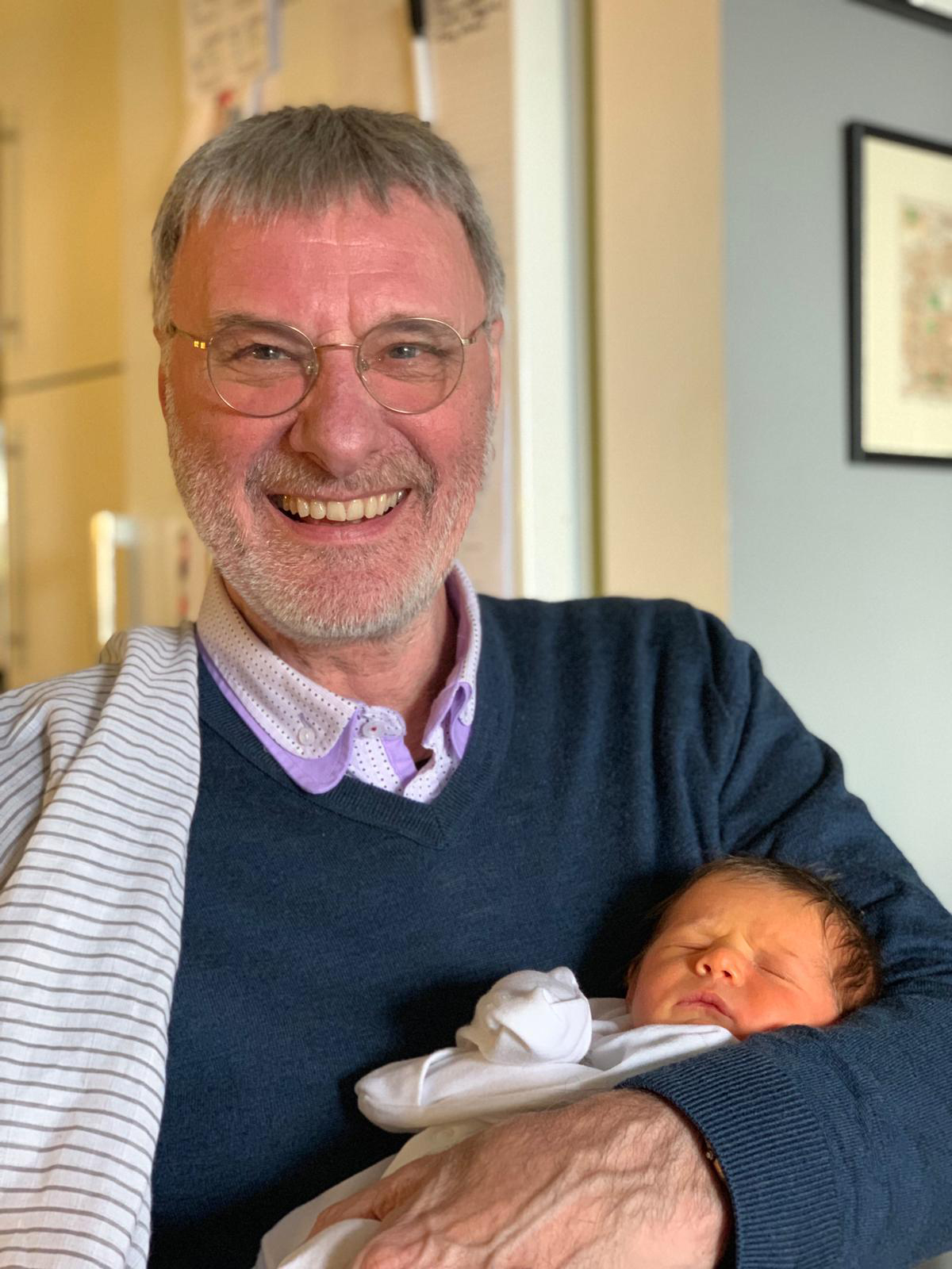 Penelope Joy Milburn, aged 4 days, with her proud Granddad Steve